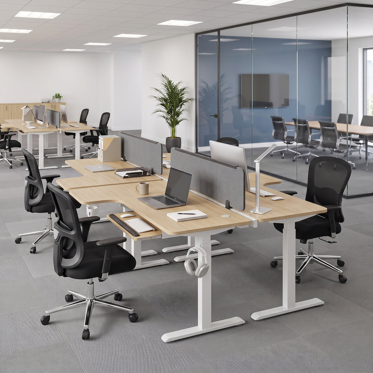 Eureka Ergonomic L-shaped standing desks in open-plan office