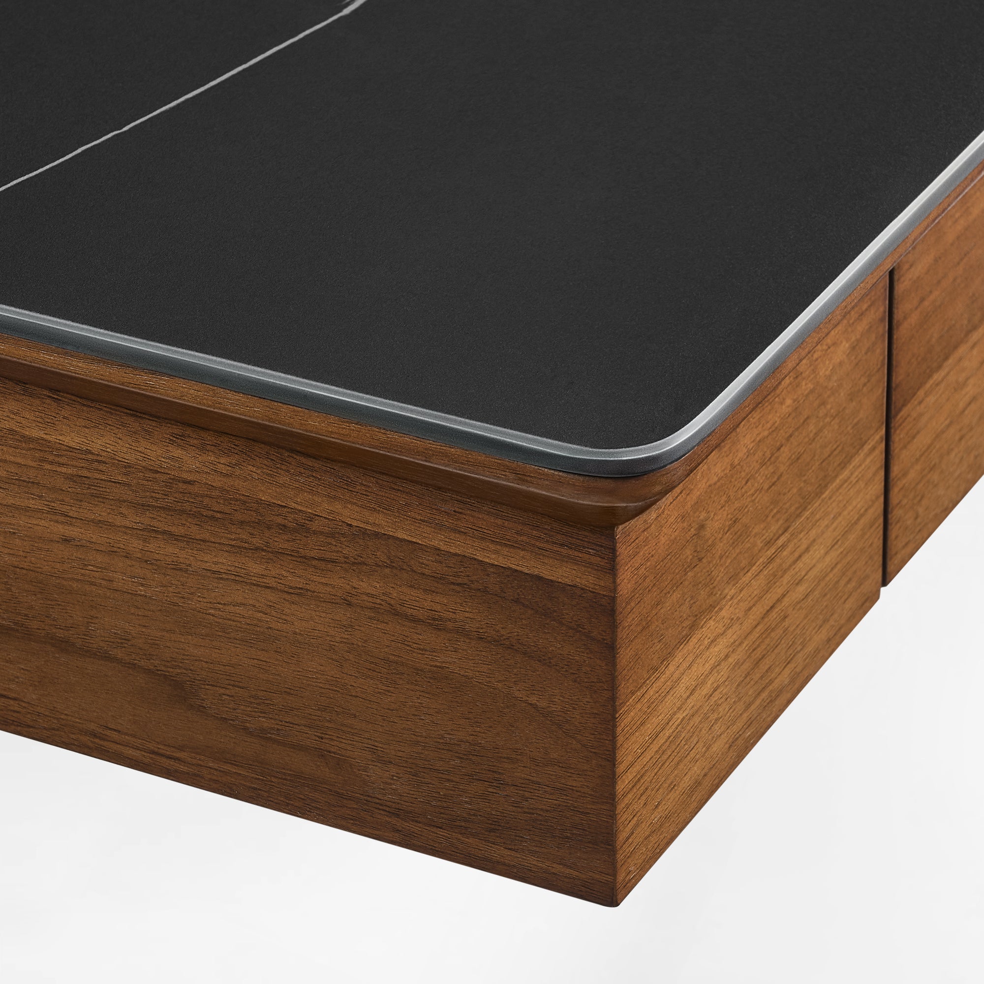 Close-up of the Ark desk’s premium black sintered stone desktop and rounded corners.