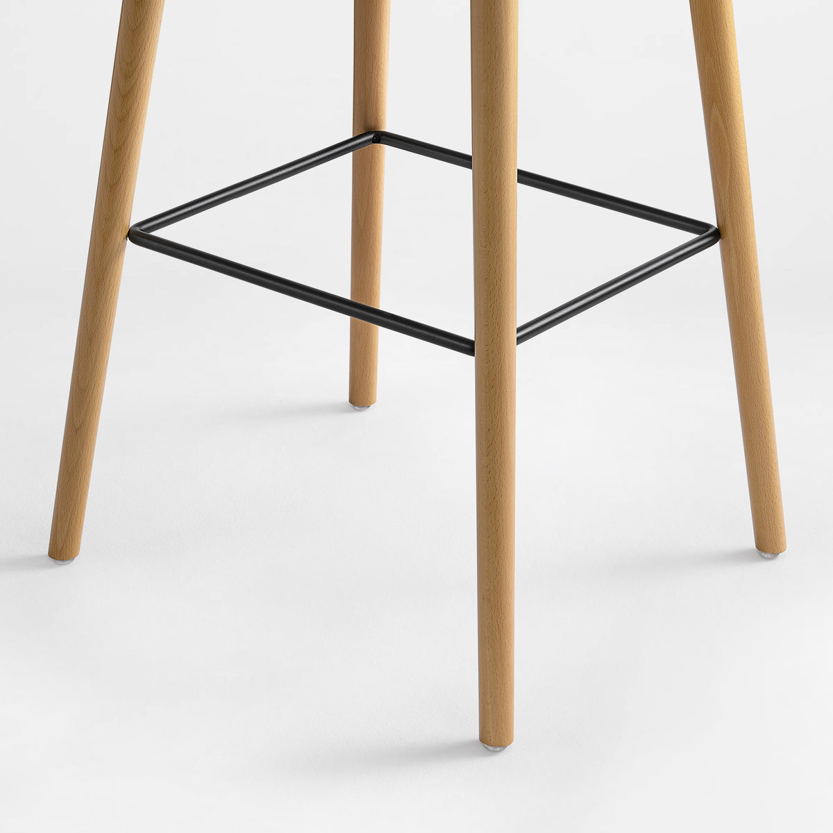 Eureka Ergonomic Perchamp oak legs with a black metal footrest