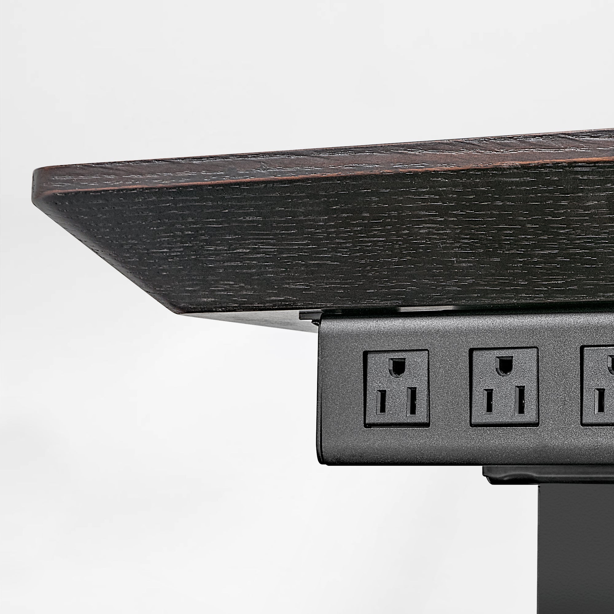Zen Classic Executive Standing Desk Detail: Dark Wood Finish With Integrated Power Outlets for an Organized Workspace.