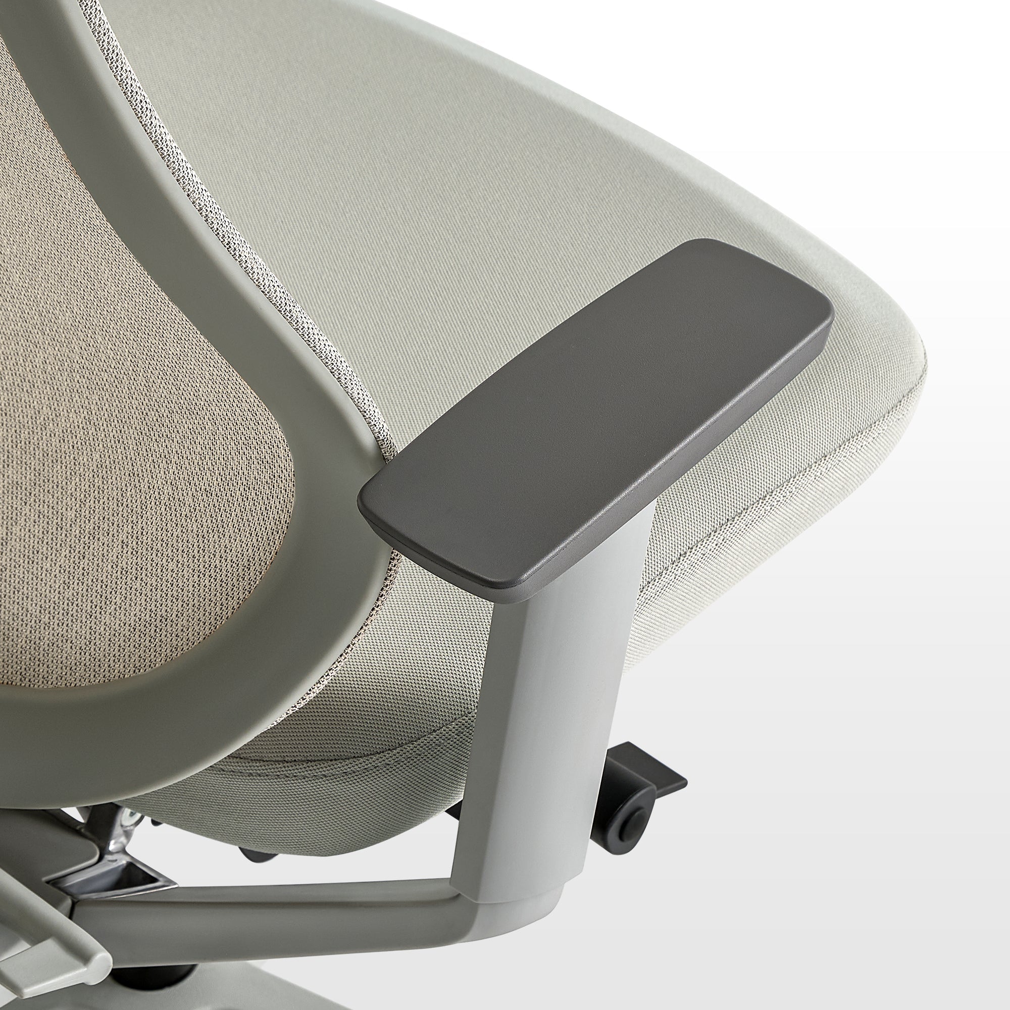 Eureka Ergonomic Lira ergonomic office chair pale green seat fabric texture, gray armrest and beige mesh backing detail.