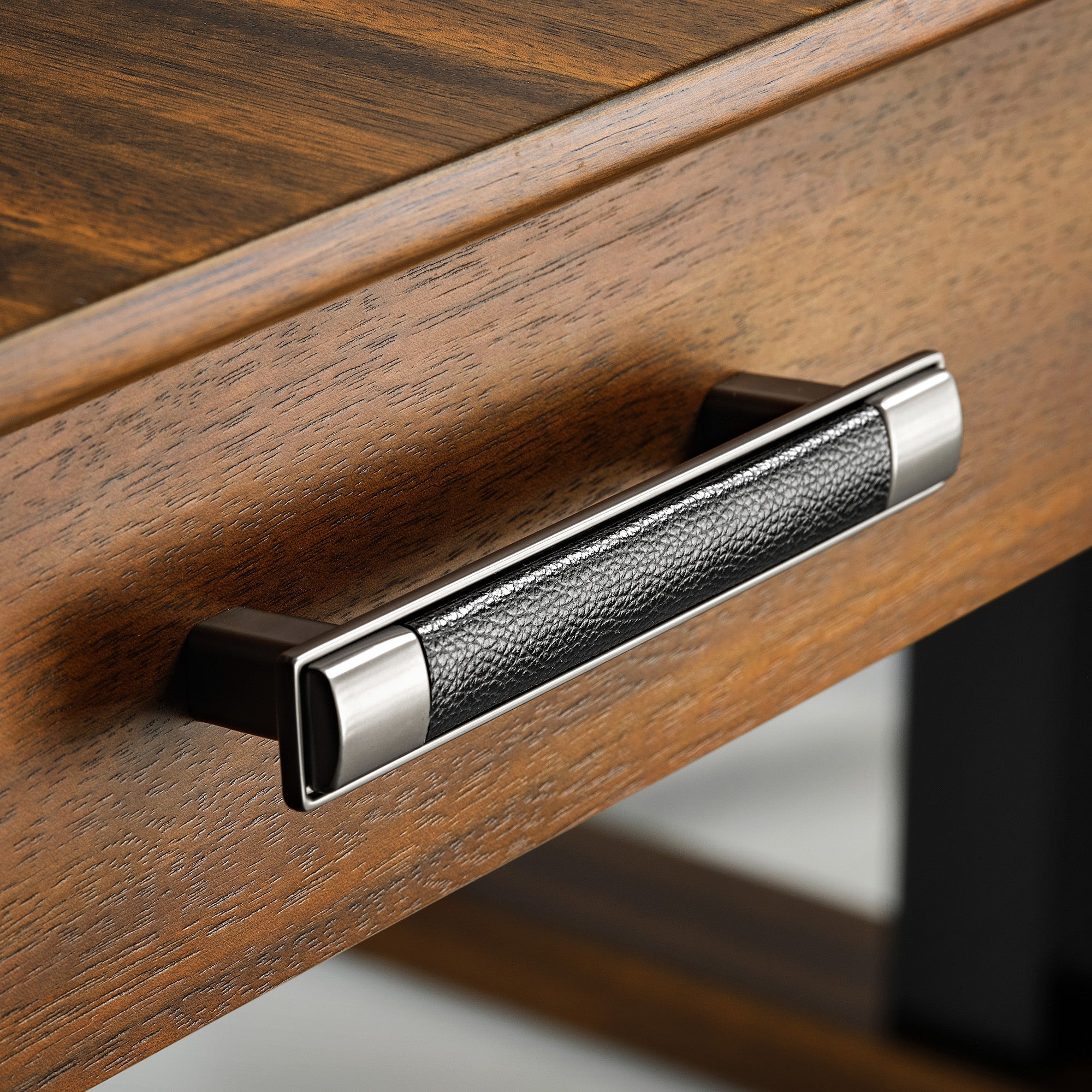 Eureka Ergonomic Ark Pro L-Shaped Desk Drawer Handle: Black Leather Grip, Walnut Wood, and Silver Accents.
