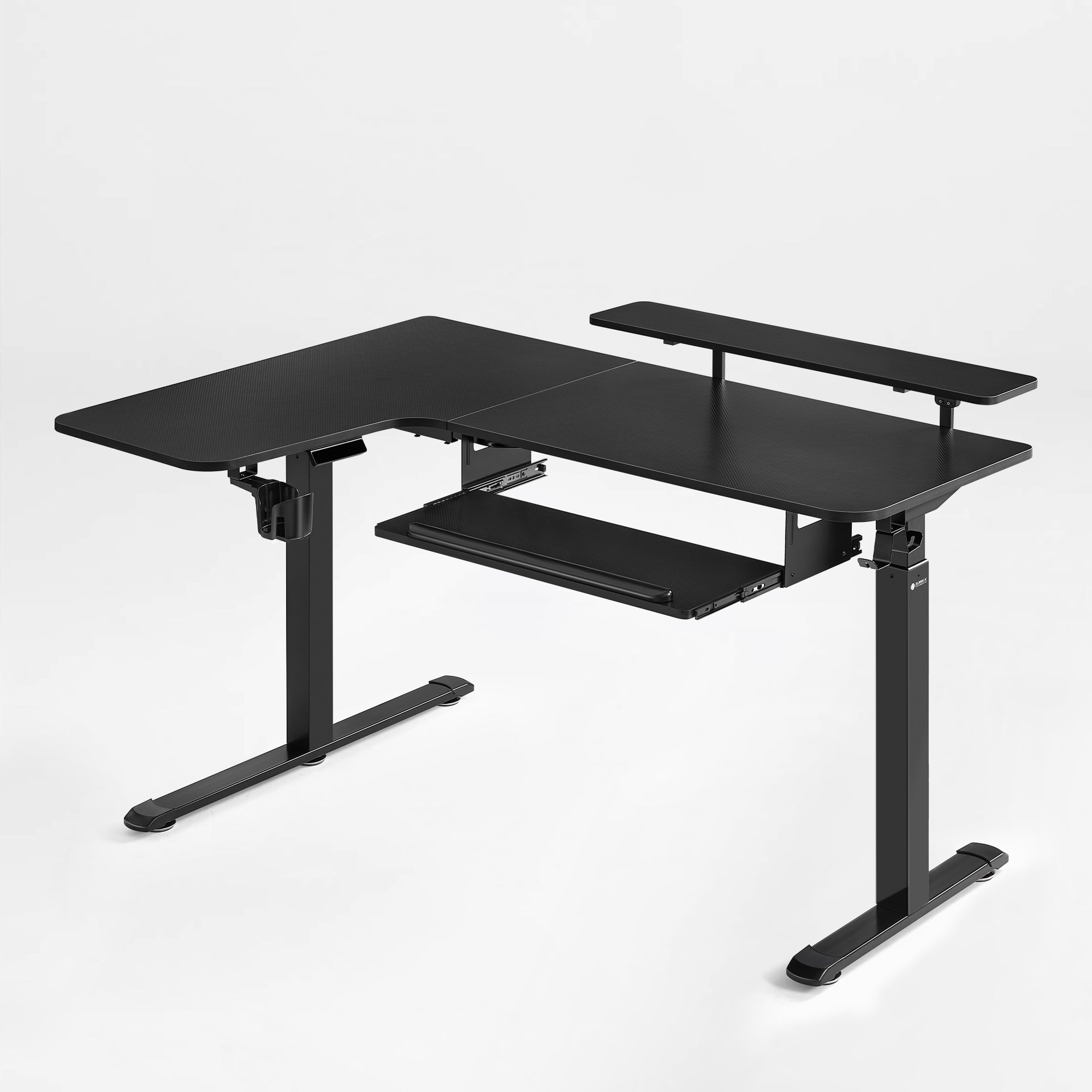 Eureka Ergonomic Maple L-shaped gaming standing desk with monitor riser, pull-out keyboard tray, and mousepad.