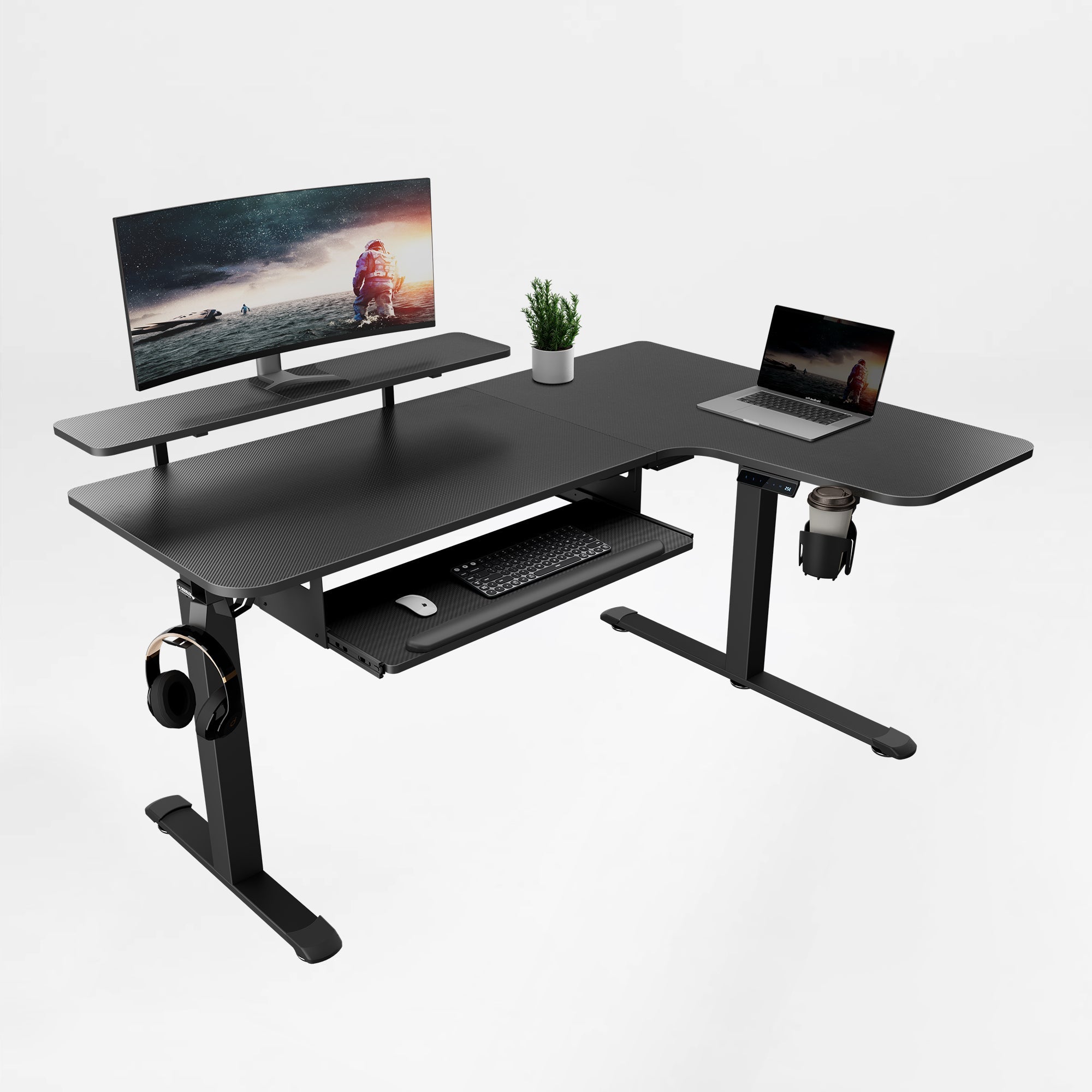 Eureka Ergonomic Black L-shaped standing desk with textured finish, monitor riser, laptop, pull-out keyboard tray, cup holder, headphone hook.