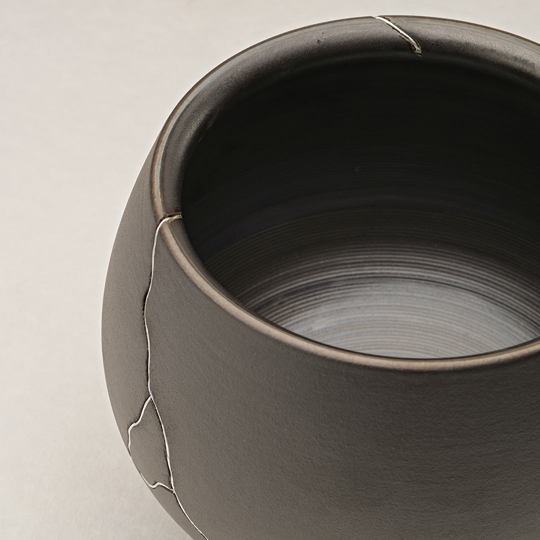 Dark Gray Ceramic Vase With Silver Crack Detailing, Ideal for Dining Table Or Shelf Decor.