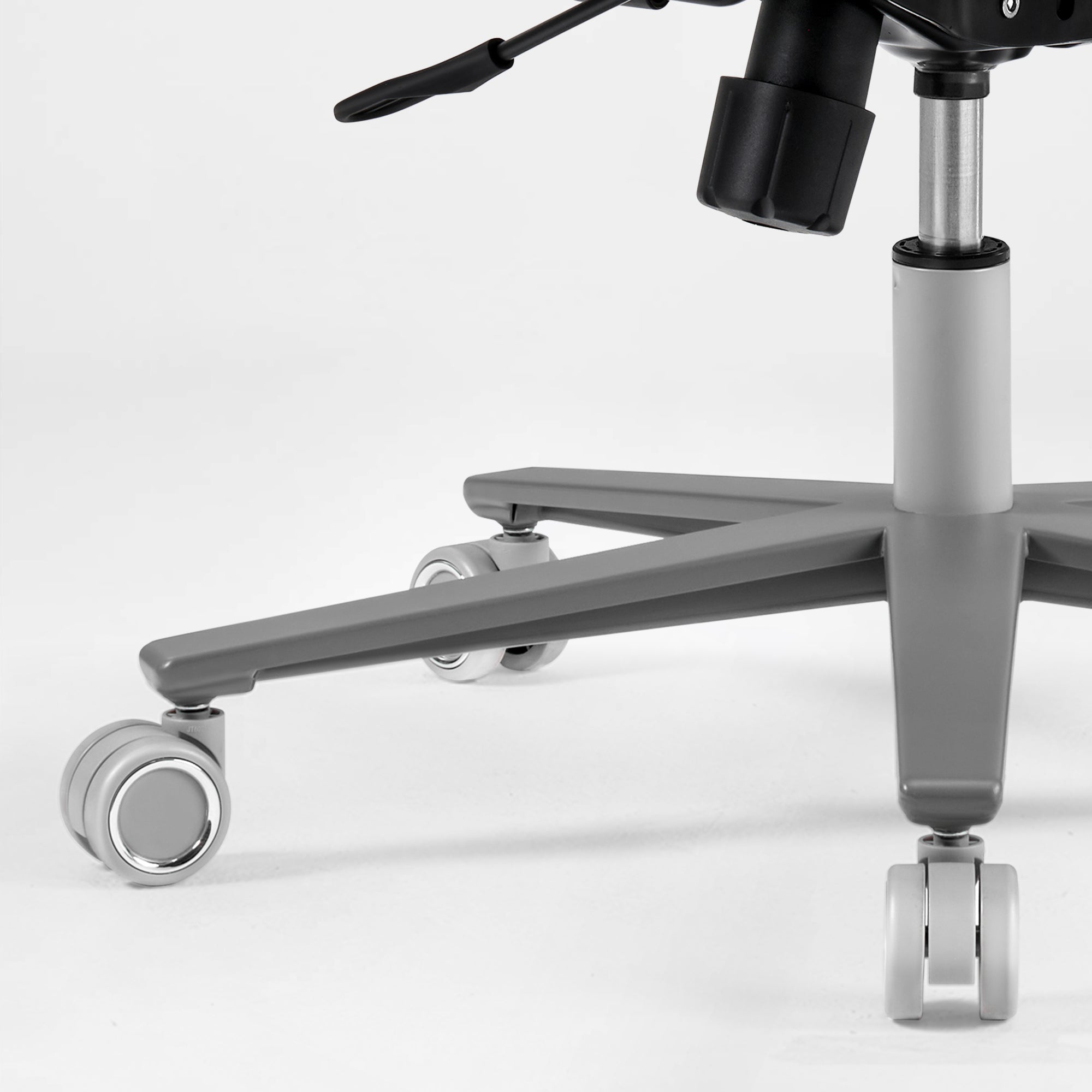 Close-up of a chair with wheels on a white background,gray