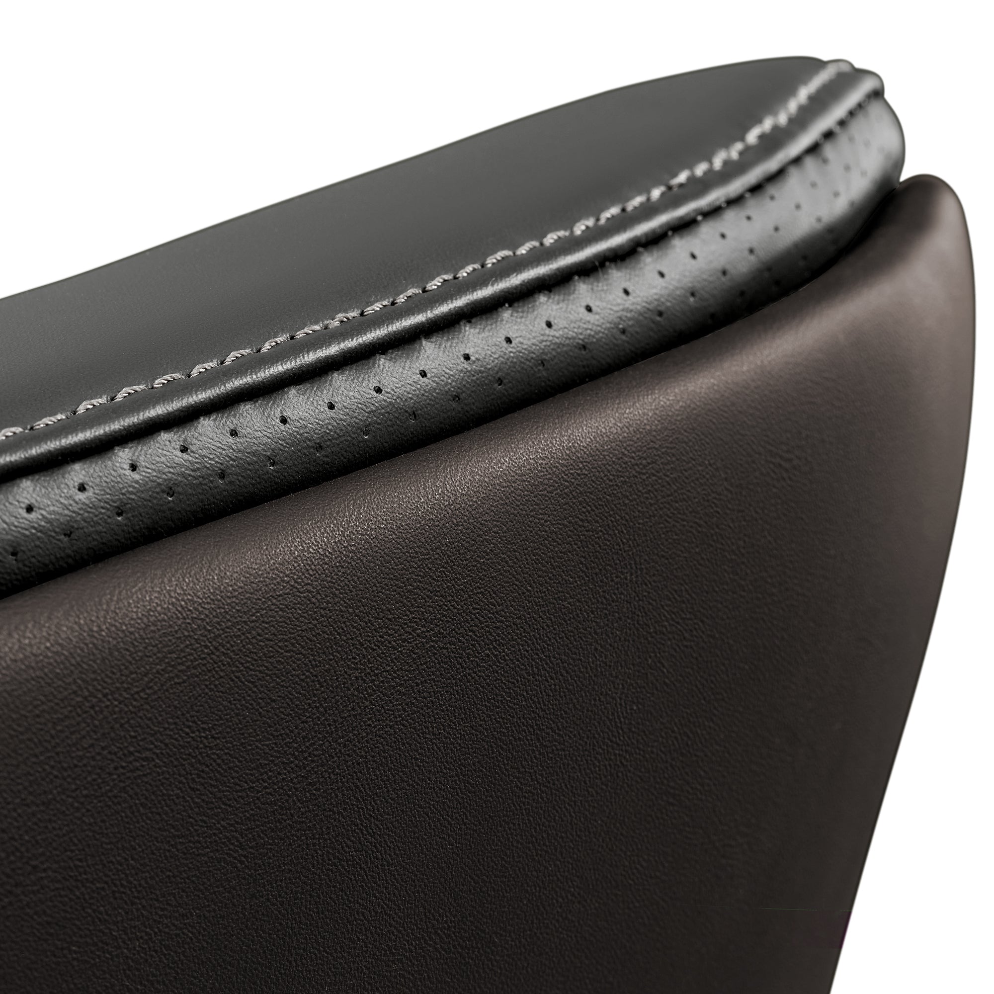 Eureka Ergonomic Close-up of Royal Slim executive chair seat cushion, showcasing champagne leather texture, perforation detail, and stitching.