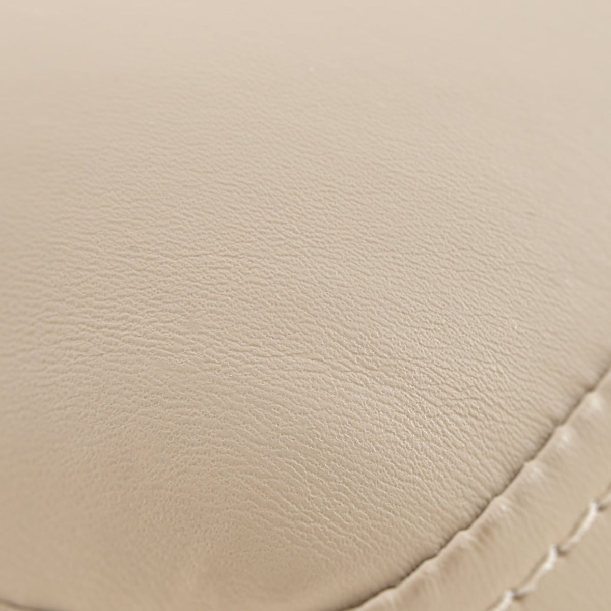 Off-White Pu Leather Upholstery Detail, Chester Dining Chair, Textured Surface.